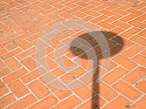 Brick wall background textured with shadow of traffic sign