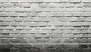A brick wall with a black and white background as a background, template, banner or page..