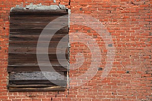Brick Wall Boarded window