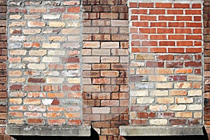 Brick wall with bricked up windows