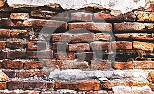 A brick wall or brickwork texture background. its decayed with age. Red brick is used to create a house or wall making