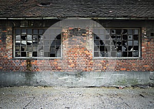 Brick wall with broken windows photo