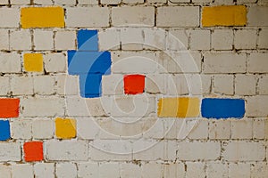 brick wall with coloured bricks