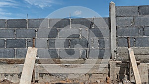 Brick wall construction. Wooden partition for the base.