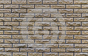 Brick wall with a contrast pattern with a broken stone background texture