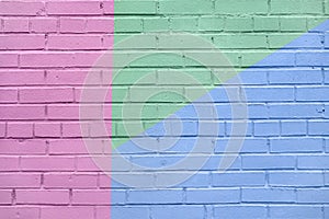 Brick wall decorated with of colorful colors. Geometric detail of a graffiti. Abstract bright background