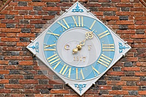 Brick wall with diamond shaped clock