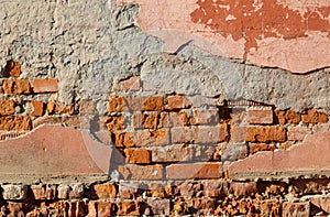 A brick wall with a few missing bricks