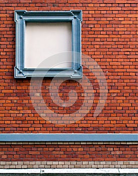 Brick wall with gray advertising frame