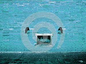 Blue Brick Wall with peeling paint background texture