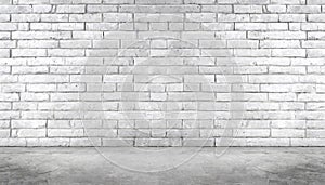 A brick wall with a large empty space in the middle. The wall is white and has a rough texture.