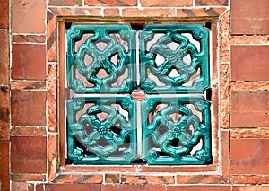 Brick wall and latticework window photo