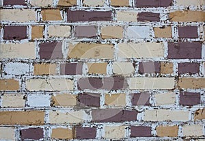 A brick wall made of colored bricks.