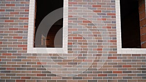 Brick wall made of expensive multi-colored bricks. corner of a textural building made of old brickwork