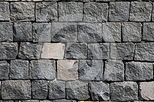 Brick wall made of lava stone. Stone background