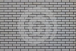 Brick wall with many gray bricks. Used as a background.