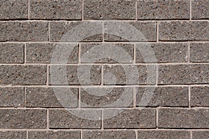 Brick wall with many gray bricks. Used as a background.