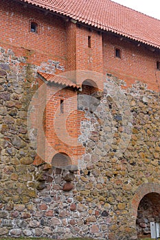 Brick wall of an old castle with toilet rooms