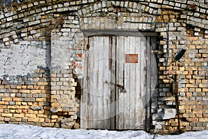 Brick wall and old wooden door