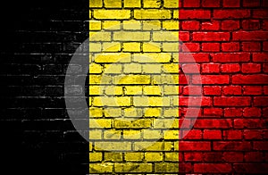 Brick wall with painted flag of Belgium