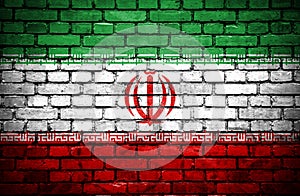 Brick wall with painted flag of Iran
