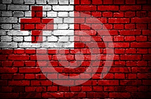 Brick wall with painted flag of Tonga