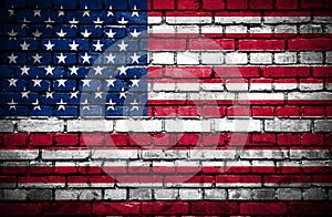 Brick wall with painted flag of United States of America