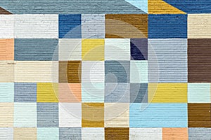 Brick wall painted in rainbow