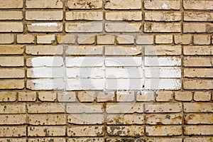 brick wall with painted splotch for your text and paper scraps as background or texture