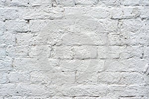 Brick wall painted with white paint with drawing the texture of bricks. Background