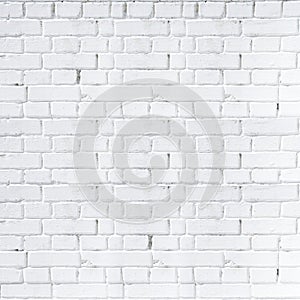 The brick wall is painted with white paint. White brick background. Square orientation.