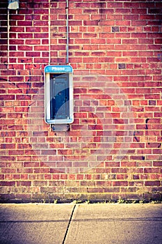 Brick wall with payphone