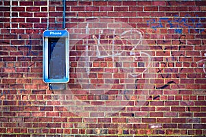 Brick wall with payphone