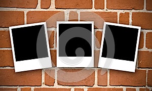 Brick wall with Polaroids