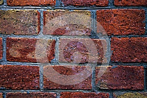 Brick wall of red brick. Brick masonry with smooth seams. Accurate brickwork