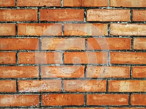 The brick wall of red color, wide panorama of masonry. Background  of old vintage brick wall