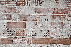 Brick wall with remaing plaster