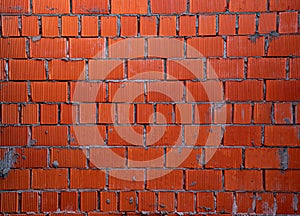 Brick wall of rough masonry. Large bricks in close-up. Walls in roughing. Brick wall texture.