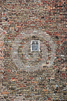 Brick wall with small window