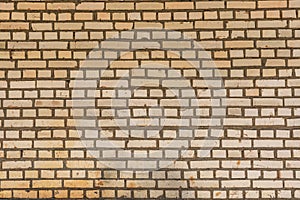 Wall from yellow bricks background texture abstract