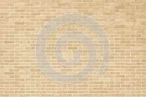 Brick wall texture pattern background in natural light ancient cream beige yellow brown