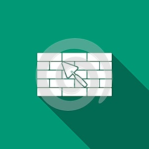 Brick wall with trowel icon isolated with long shadow