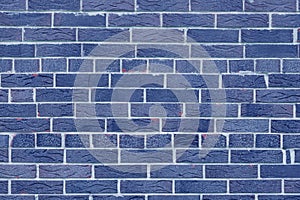 Brick wall with unusual blue bricks made of whole blue bricks
