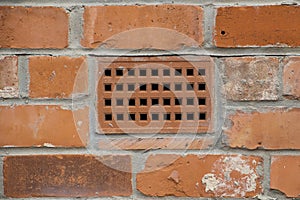 Brick wall with a ventilation brick