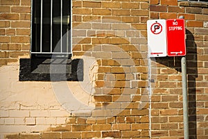 Brick wall window security grill sign posts