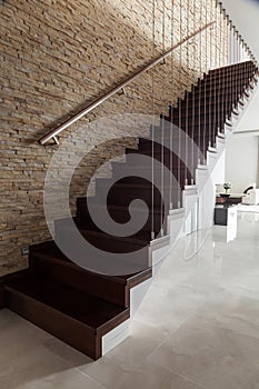 Brick wall and wooden stairs