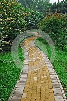 A brick windy garden path