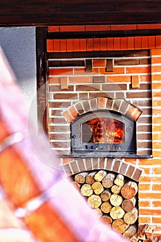 Brick , wood Pizza oven with fire in it