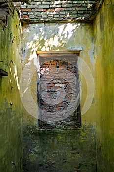 A bricked-up window in an old building