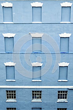 Bricked windows and blue walls